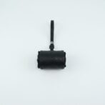 Black leather camera pouch with a vertical strap centered on a pale background?